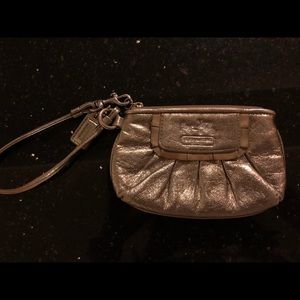 Gold coach wristlet